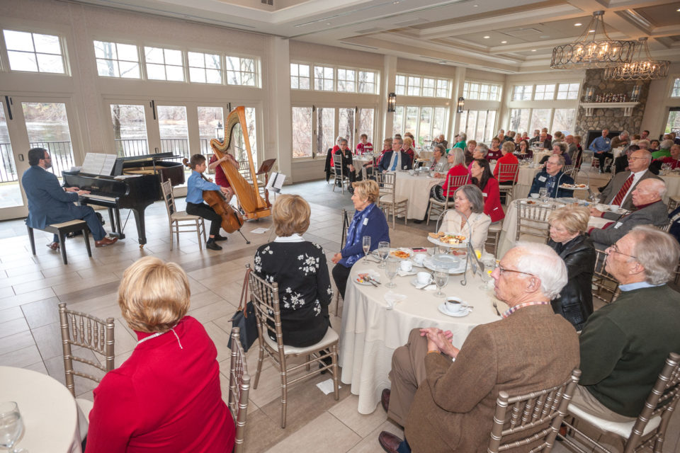 Vantage Club Memers listen to harp cello and piano