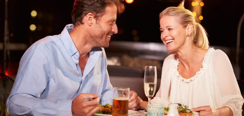 Empty nester couple enjoying dinner