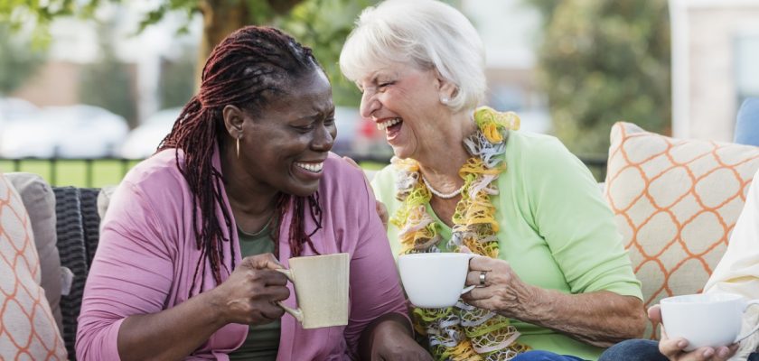 Two people laughing together.