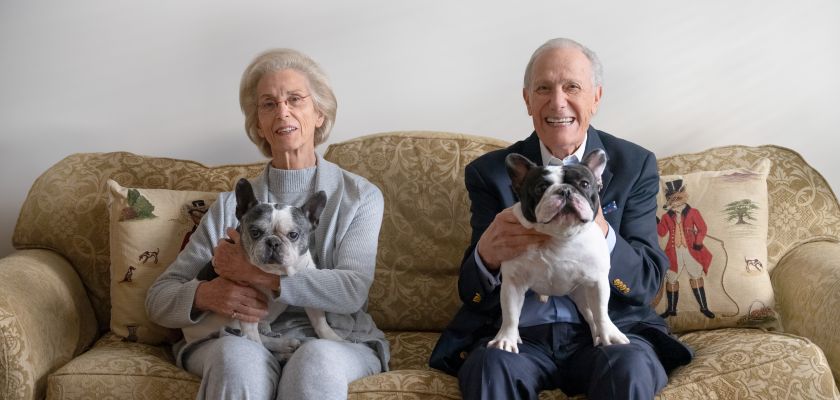 Couple on couch with their dogs
