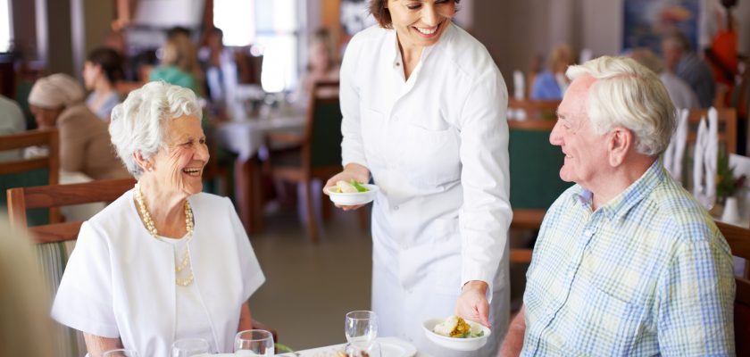 Fine Dining Chef serving a couple at dinner table