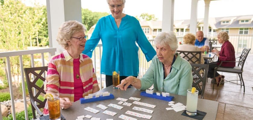 ladies at outdoor table playing game